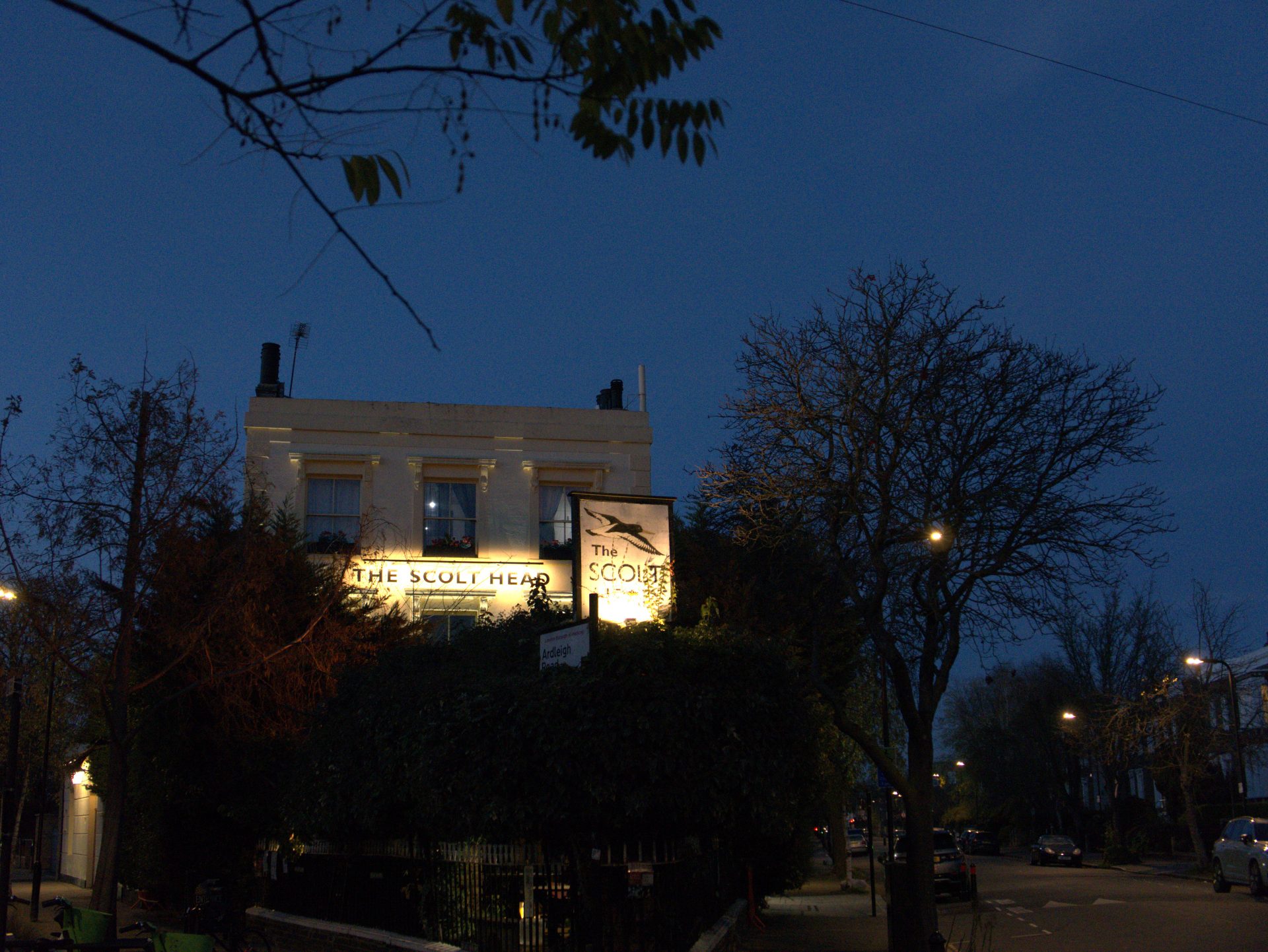 The Scott Head pub, Culford Road, lit up at dusk