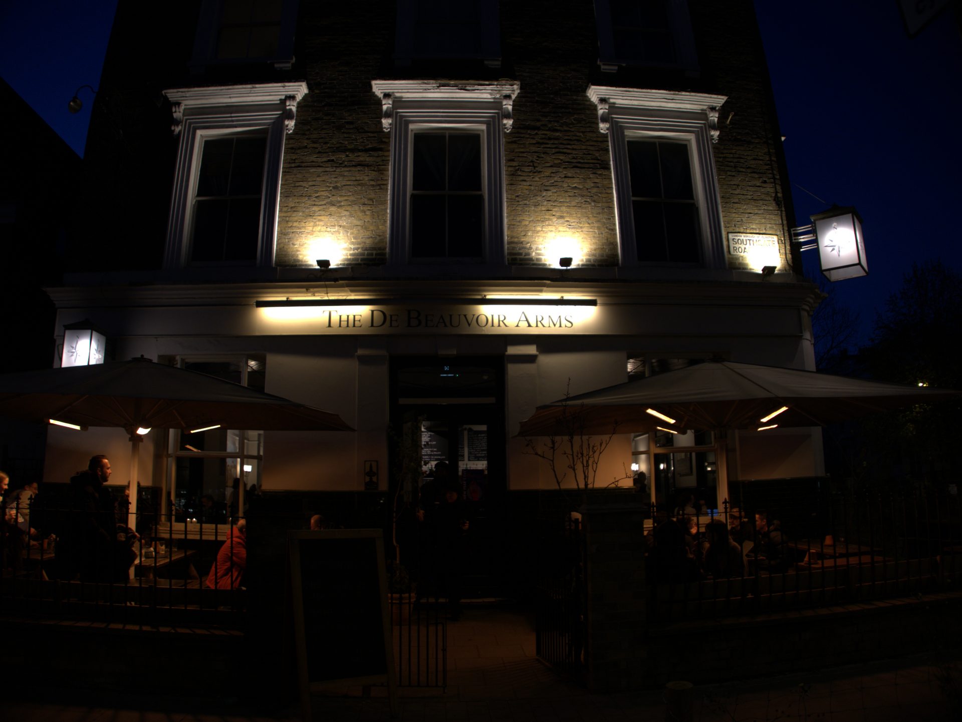 The face of De Beauvoir Arms pub, Southgate Road at dusk